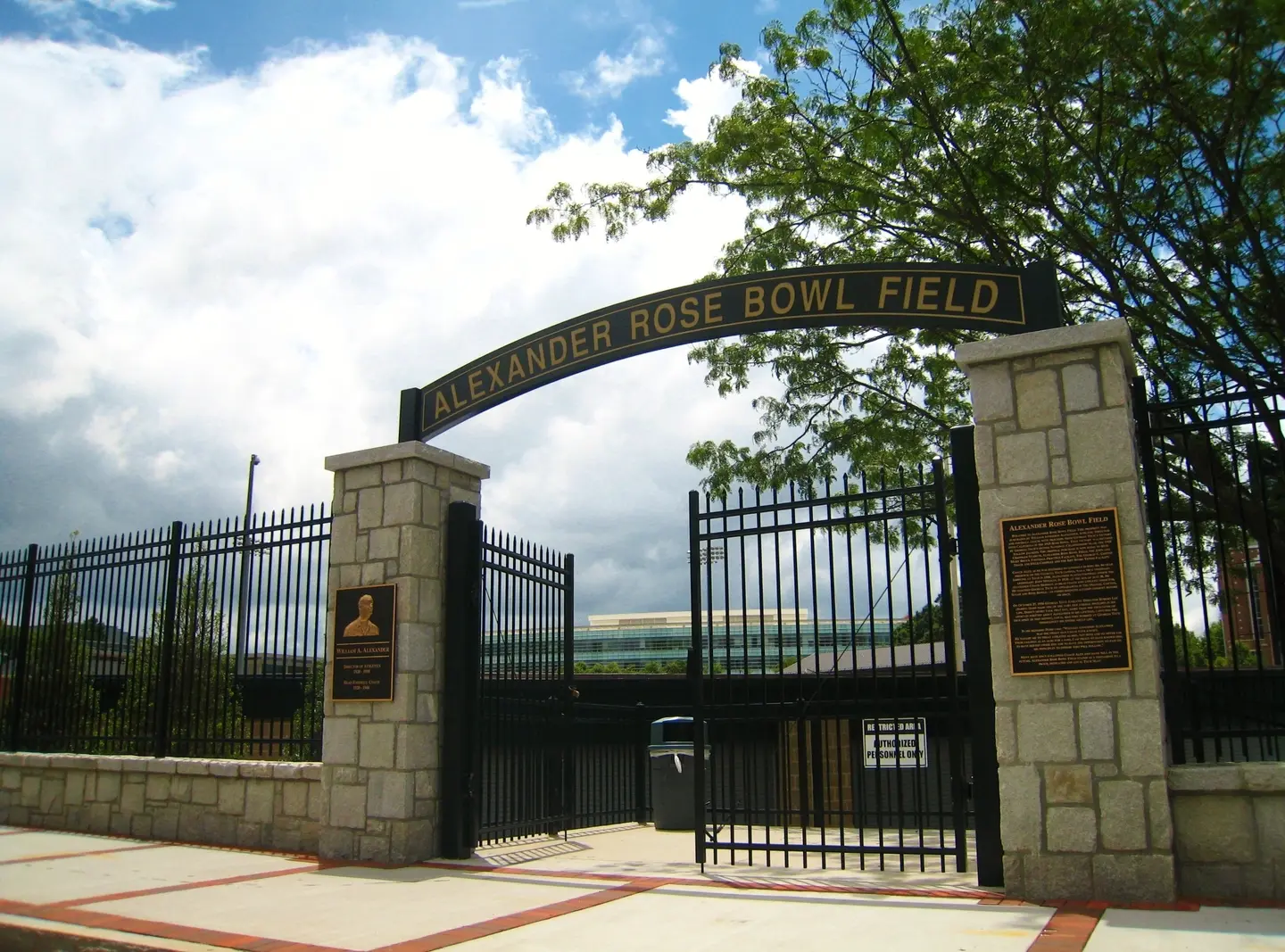 A gate that is in front of a building.