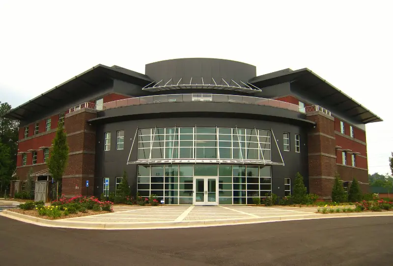 A large building with many windows and doors.