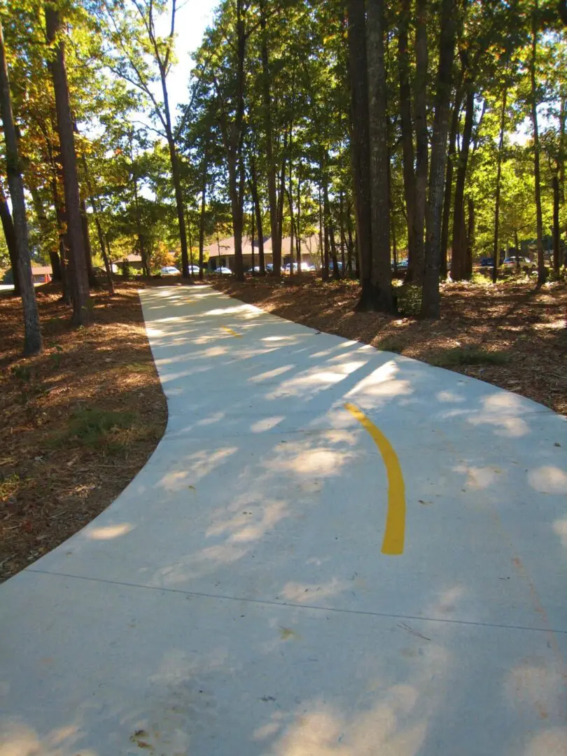 A white and yellow line on the side of a road.