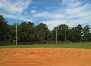 A baseball field with the base ball ring in the middle.